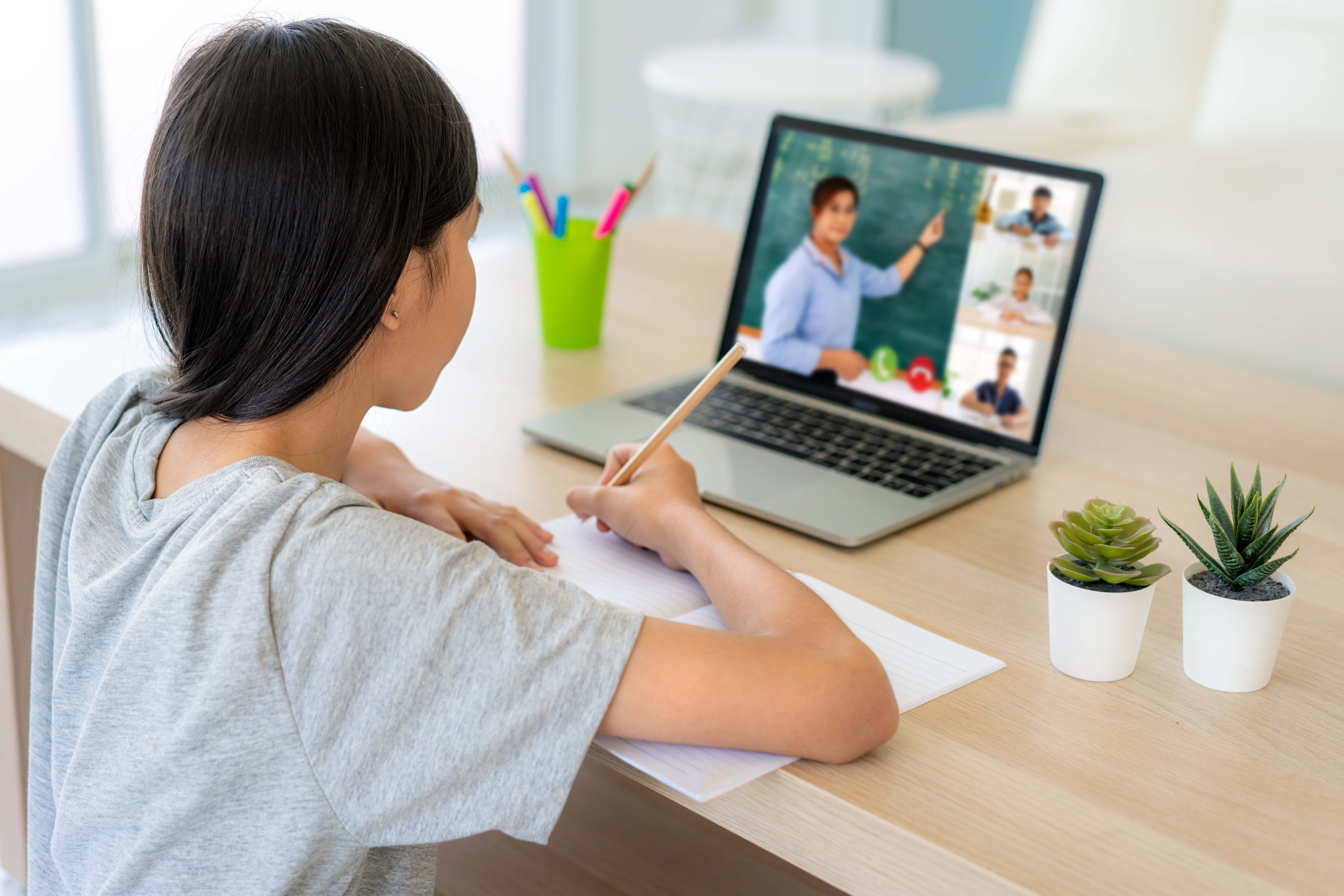 asian-girl-student-video-conference-e-learning-with-teacher-classmates-computer-living-room-home