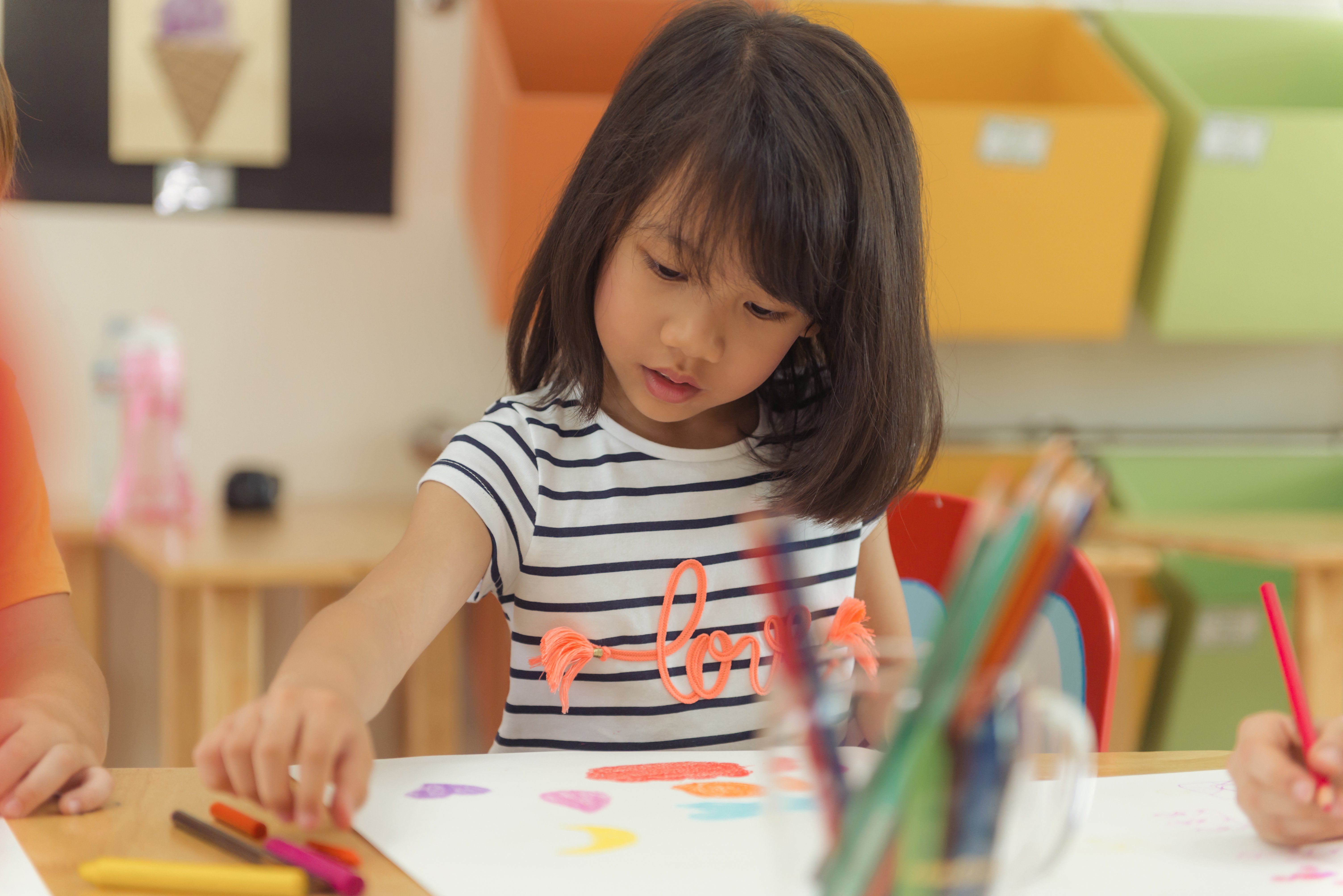 girl-drawing-color-pencils-kindergarten-classroom-preschool-kid-education-concept-vintage-effect-style-pictures