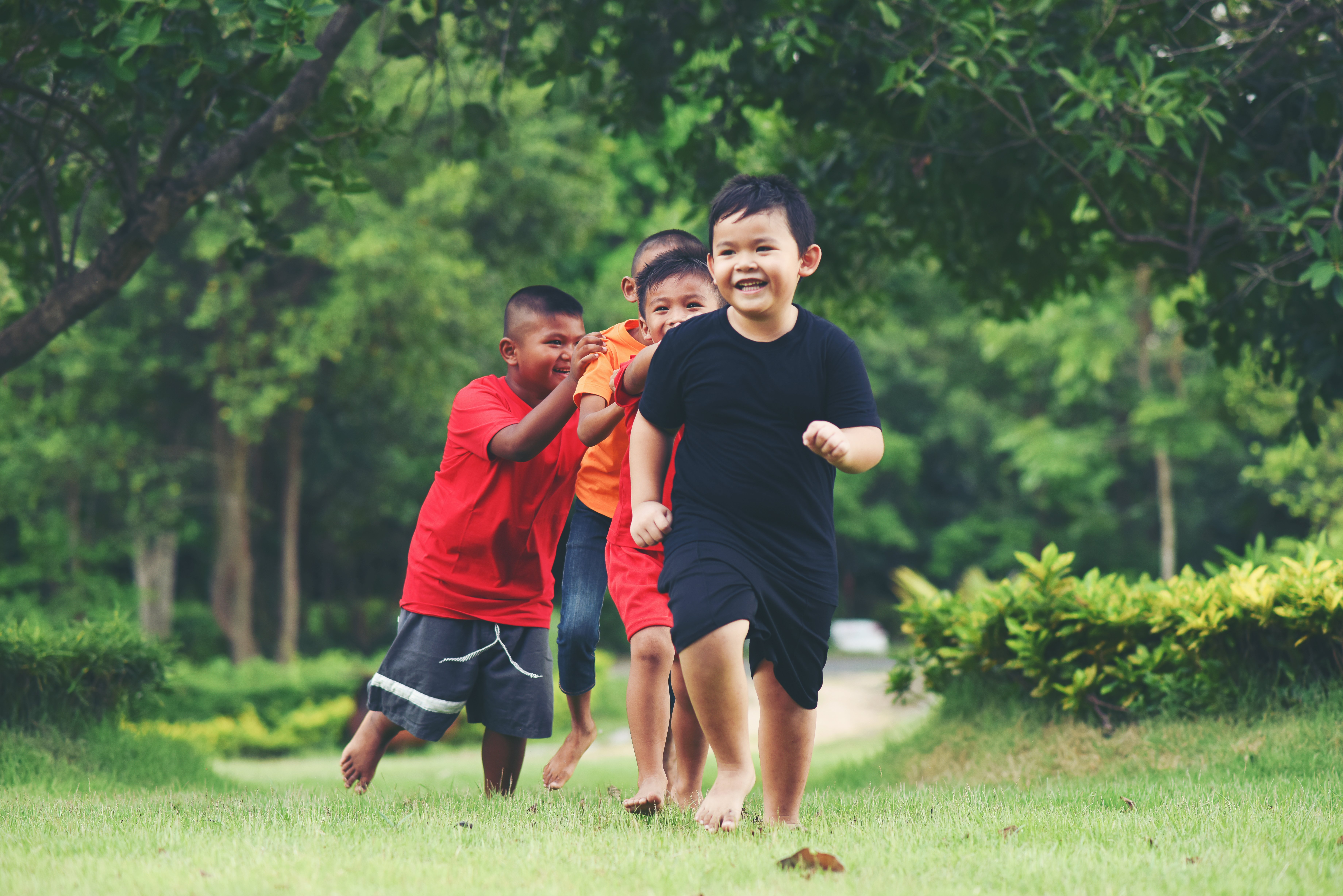 group-young-children-running-playing-park