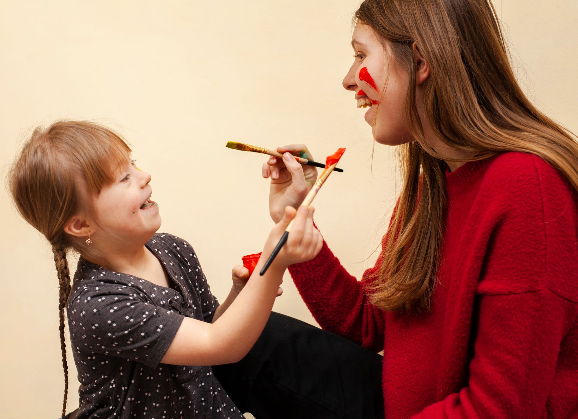 happy-woman-girl-with-down-syndrome-painting-each-other-s-faces
