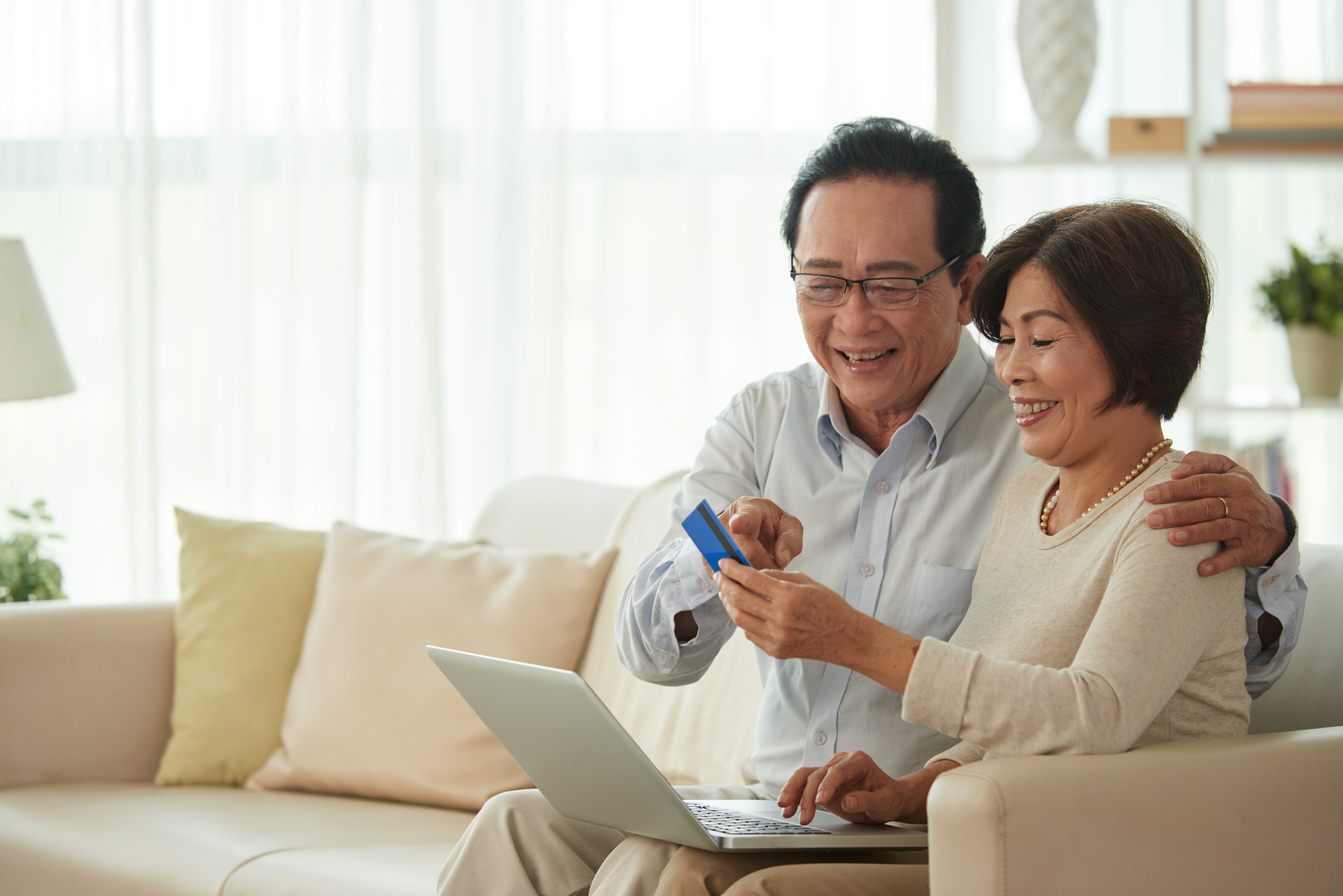 middle-aged-man-woman-doing-online-shopping