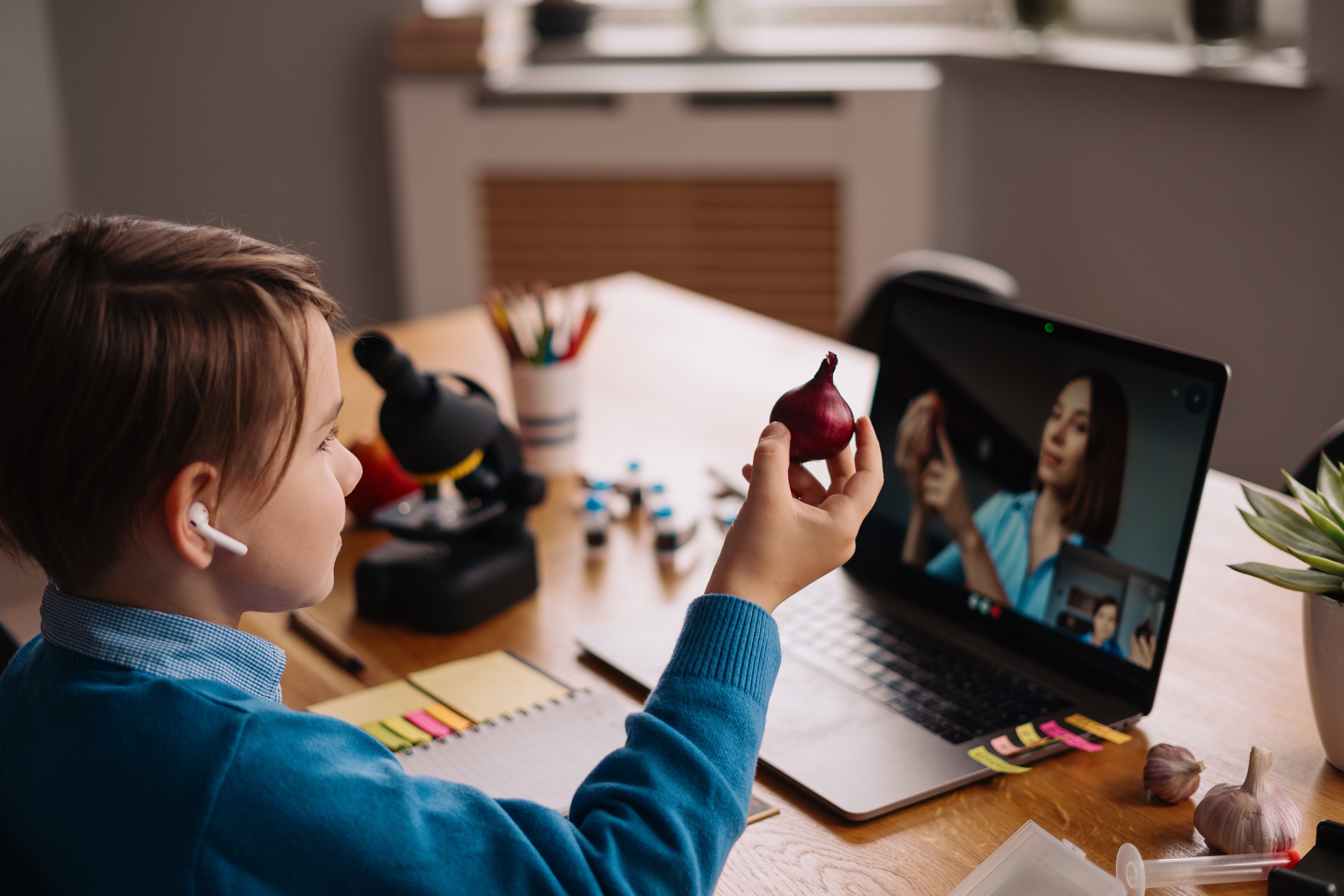 preteen-boy-uses-laptop-make-video-call-with-his-teacher-2