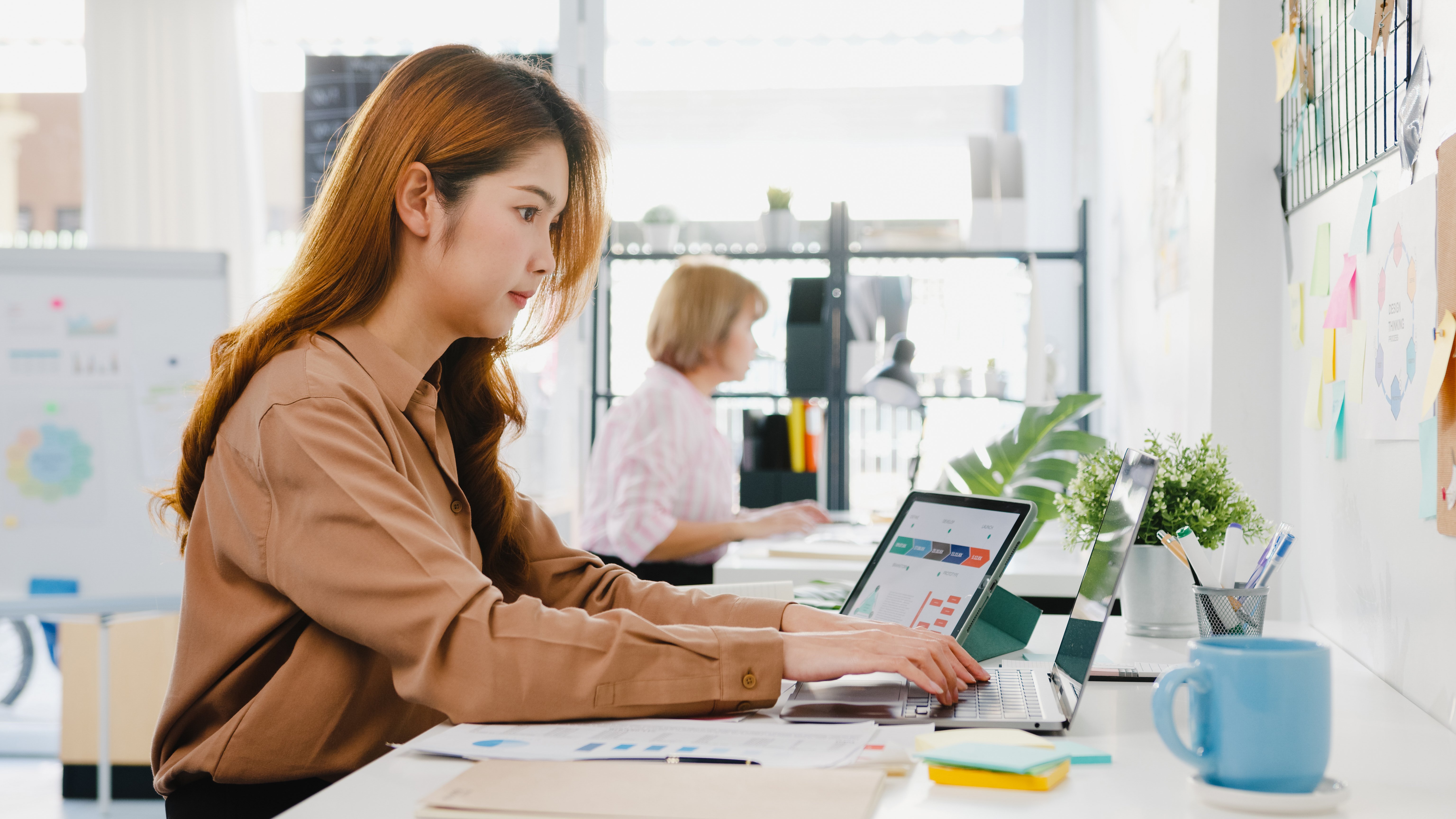 young-asia-businesswoman-entrepreneur-social-distancing-new-normal-situation-virus-prevention-while-using-laptop-computer-tablet-back-work-office