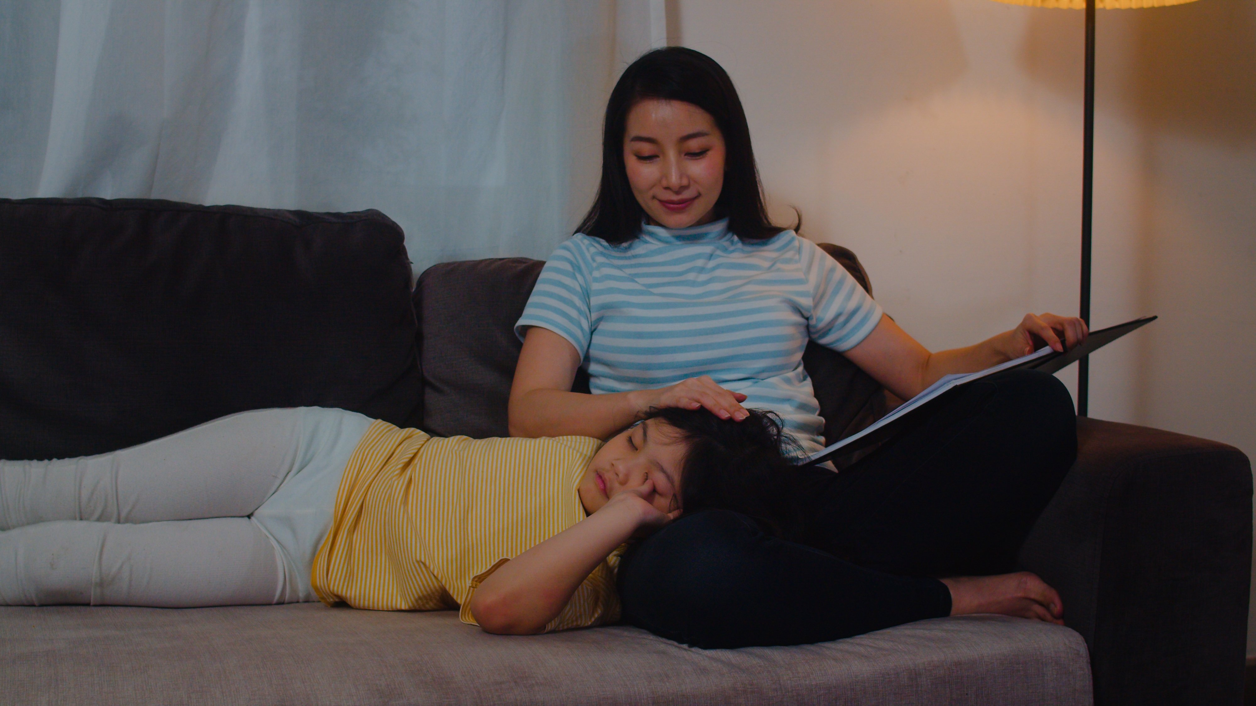 young-asian-mother-read-fairy-tales-her-daughter-home-happy-chinese-family-relax-with-teen-girl-who-sleep-while-listening-tales-lying-bed-bedroom-modern-house-night