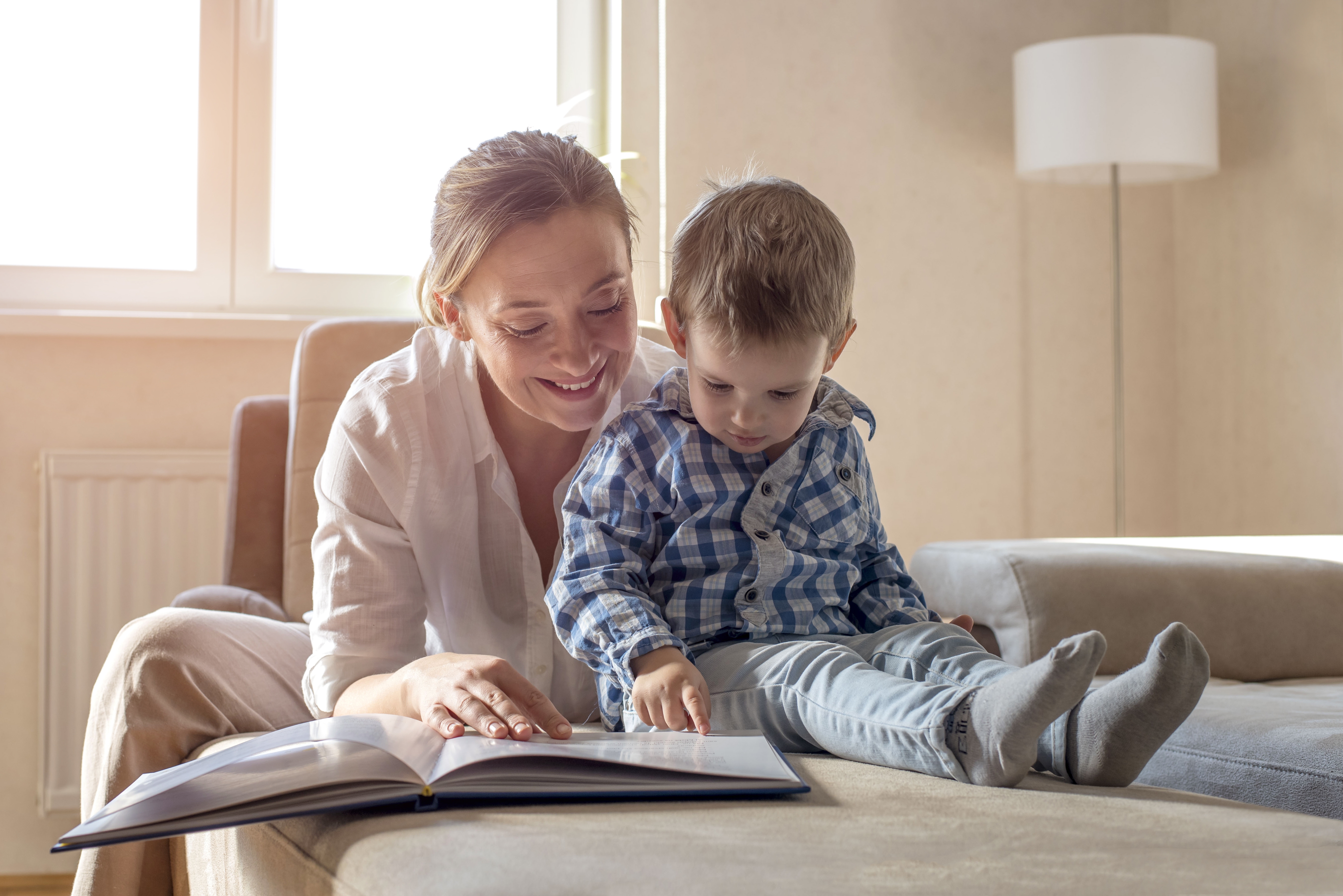 young-mother-reading-book-her-little-boy-with-blue-shirt